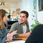 people sitting while having a conversation