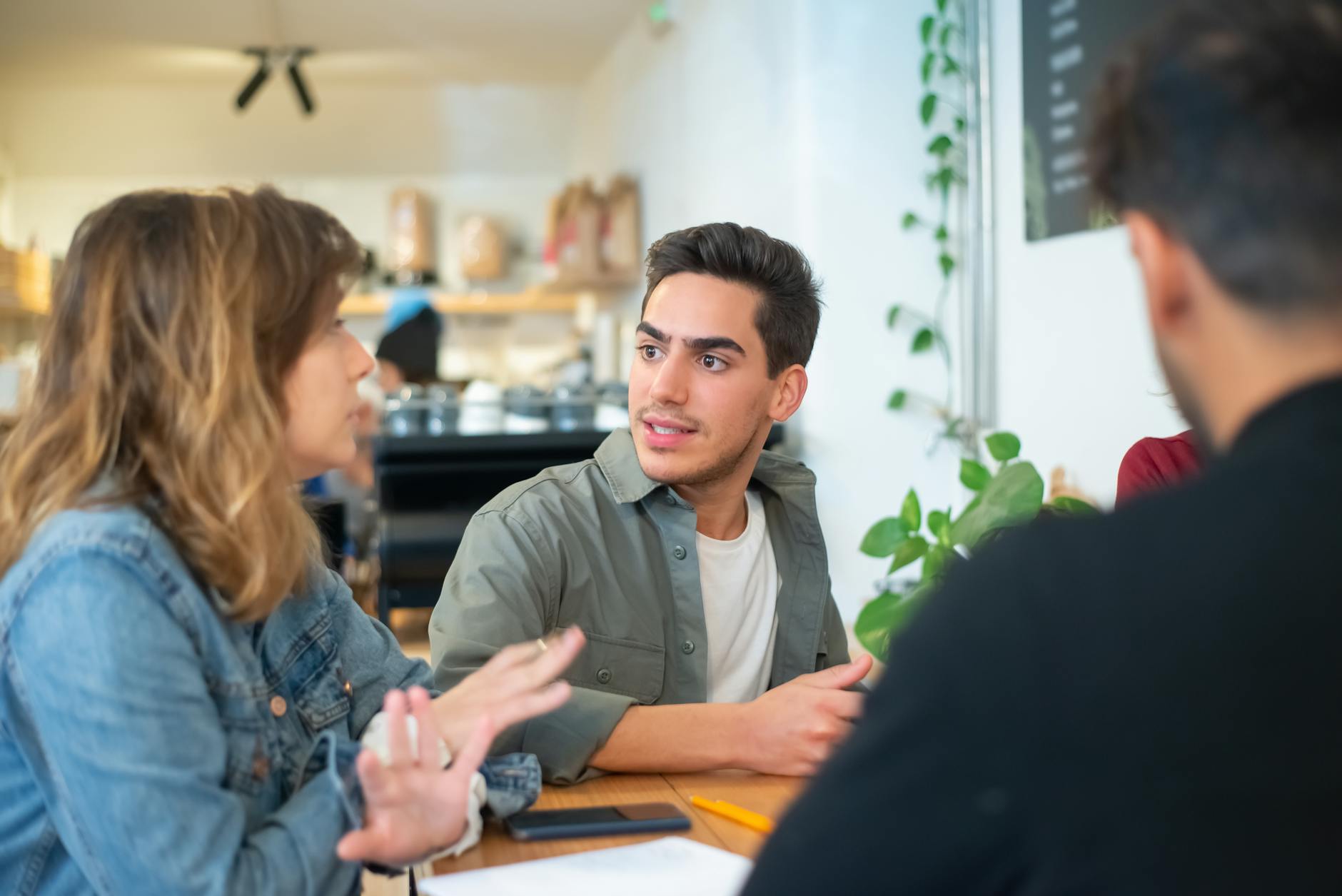 people sitting while having a conversation